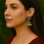 Viva Jewels Antique Gold-Finish "Surajmukhi" Jhumkas – Traditional Oxidized Brass Earrings with Intricate Tribal Patterns and Serrated Edge Detail
