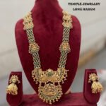 Viva Jewels Royal Temple Heritage Long Haram – Gold-Plated Long Necklace with Grand Lakshmi & Peacock Pendant, Emerald-Green Stone Inlays, and Matching Statement Jhumkas